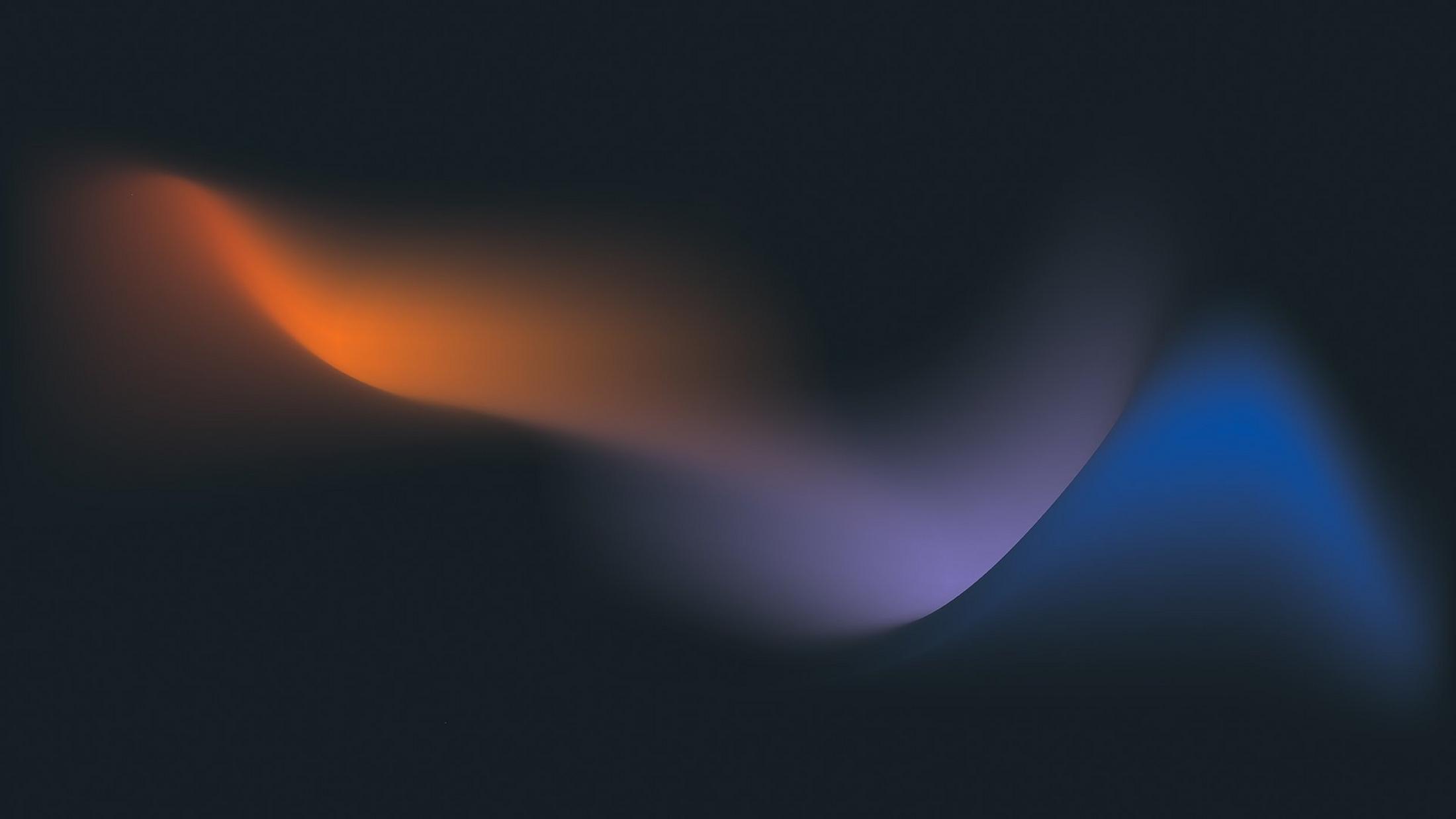 a dark background with a blue and orange light wave